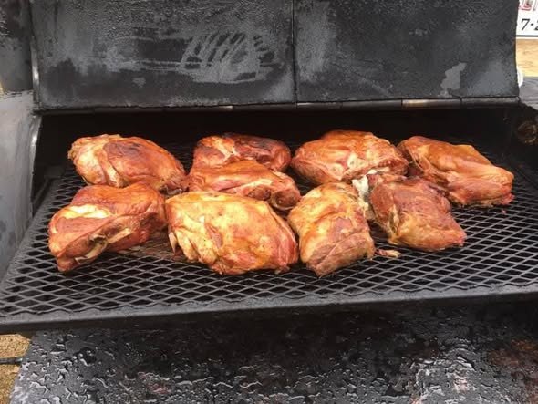 Smoked chicken coming off the pit