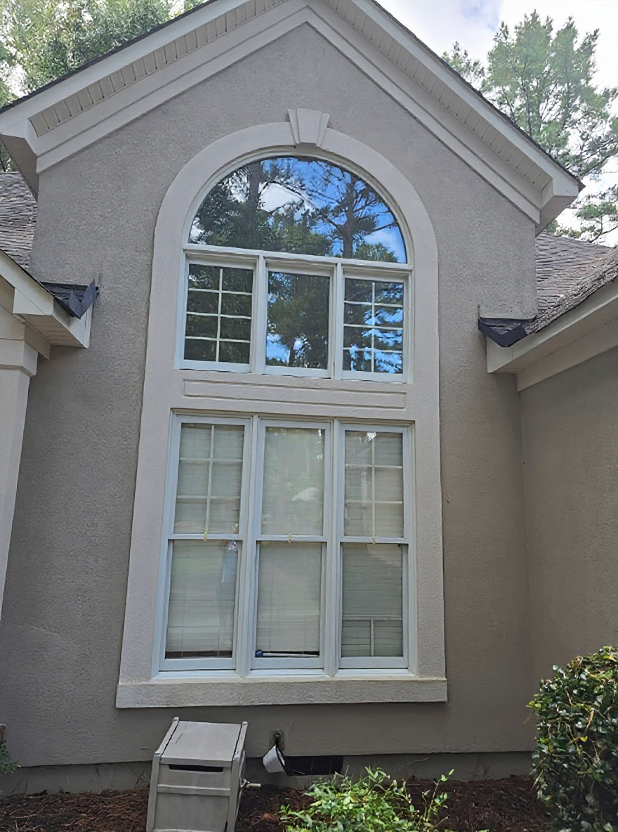 Stucco and arched window after a soft wash